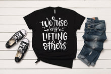 Load image into Gallery viewer, We Rise By Lifting Others T-Shirt